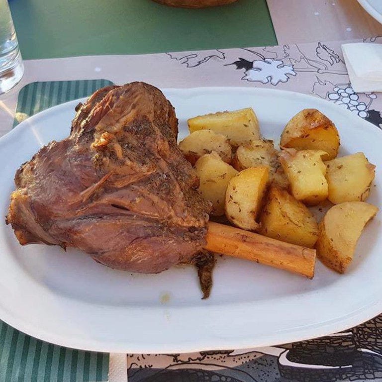 plate with lamb with potatoes cooking on the oven at 'Manalis Winery' restaurant